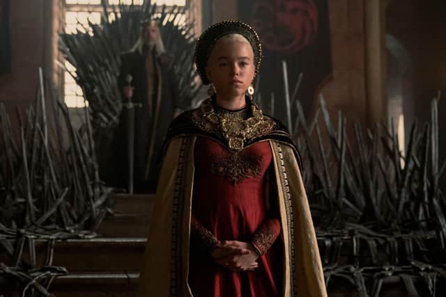 Rhaenyra Targaryen (Milly Alcock) stands in front of the Iron Throne in House of the Dragon (HBO)