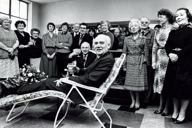 Norman Hanlon, managing director of Sanderson Kayser Limited, Newhall Road Sheffield, takes it easy in one of the garden chairs presented to him on behalf of the staff and workforce at the firm by Joe Reaney, sales manager of the finished products department, watched by the staff on March 25, 1981.  Mr Hanlon was Master Cutler in 1975.
