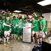 Celtic players celebrate winning another Scottish Premiership title in the away changing room at Tannadice (Photo by Craig Williamson / SNS Group)