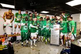 Celtic players celebrate winning another Scottish Premiership title in the away changing room at Tannadice (Photo by Craig Williamson / SNS Group)