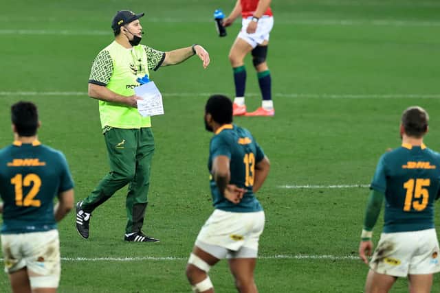 Rassie Erasmus, South Africa's director of rugby, acts as a water carrier as he issues instructions to the Springboks during the first Test against the British & Irish Lions. David Rogers/Getty Images