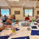 A group of participants working on their painting