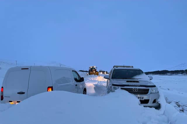 Snowdrifts trapped vehicles on the A835 overnight. Picture: John MacLean/PA Wire