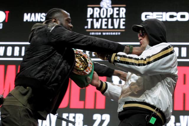 Deontay Wilder and Tyson Fury get into an altercation during their press conference at the MGM Grand Las Vegas (Photo: JOHN GURZINSKI/AFP via Getty Images)