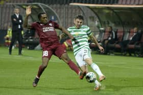 Greg Taylor battles for possession with Sarajevo's Matthias Fanimo. Picture: AP