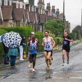 Runners take part in the Full Edinburgh Marathon in the rain. Picture: Andy O'Brien