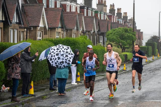 Runners take part in the Full Edinburgh Marathon in the rain. Picture: Andy O'Brien
