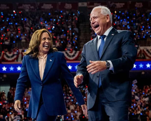 Democratic presidential candidate, U.S. Vice President Kamala Harris and Democratic vice presidential nominee Minnesota Gov. Tim Walz walk out on stage together during a campaign event on August 6, 2024 in Philadelphia, Pennsylvania.  (Photo by Andrew Harnik/Getty Images)