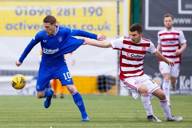 Rangers midfielder Steven Davis, pictured in action against Ronan Hughes of Hamilton Accies, is described as 'a manager's dream' by Steven Gerrard. (Photo by Alan Harvey / SNS Group)