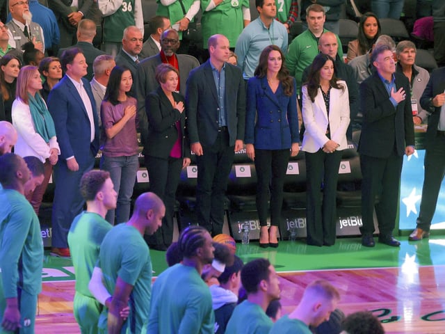 The royal couple stand for a rendition of the Star Spangled Banner as the Boston Celtics prepare to take on Miami Heat in their NBA showdown.
