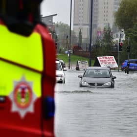 Cars are stuck in floodingin Rutherglen. Photo: John Devlin