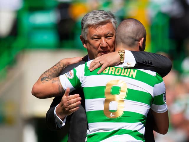 Celtic's Scott Brown embraces Chief Executive Peter Lawwell (left) after clinching the league title in 2018.