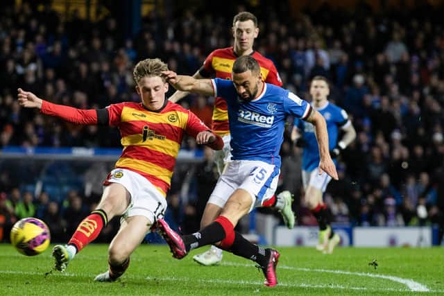 McAvoy challenges Kemar Roofe during a match against Rangers while on loan at Partick Thistle.