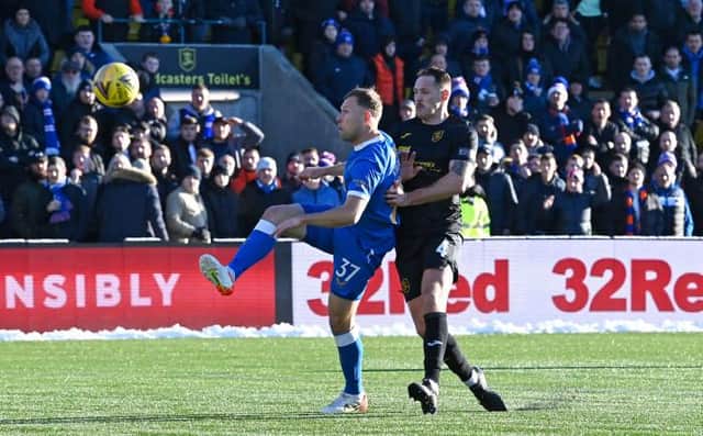 Scott Arfield lobs the ball home to open the scoring for Rangers at Livingston on Sunday afternoon. (Photo by Rob Casey / SNS Group)