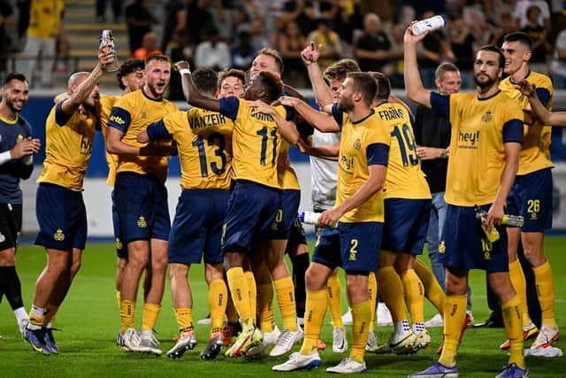 Union's players celebrate at the end of the 2-0 first leg win over Rangers (Photo by LAURIE DIEFFEMBACQ/BELGA/AFP via Getty Images)