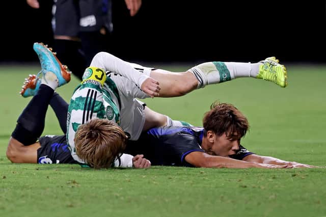 Celtic forward Kyogo Furuhashi takes a tumble during the 1-0 win over Gamba Osaka in Japan.