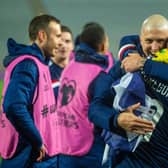 Scotland's Callum McGregor and Lyndon Dykes  celebrate at full time (Photo by Nikola Krstic / SNS Group)