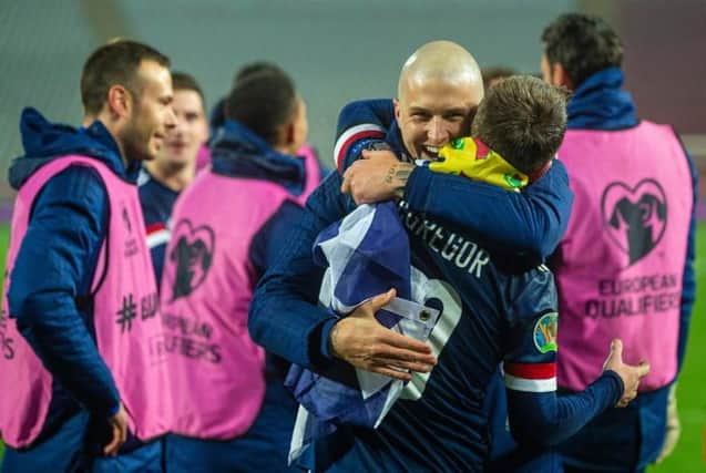 Scotland's Callum McGregor and Lyndon Dykes  celebrate at full time (Photo by Nikola Krstic / SNS Group)