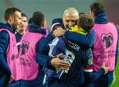 Scotland's Callum McGregor and Lyndon Dykes  celebrate at full time (Photo by Nikola Krstic / SNS Group)