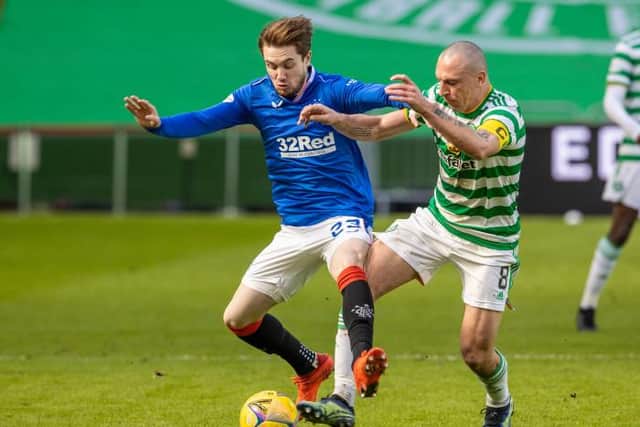 Rangers' Scott Wright (left) and Celtic's Scott Brown battle for possession. (Photo by Alan Harvey / SNS Group)