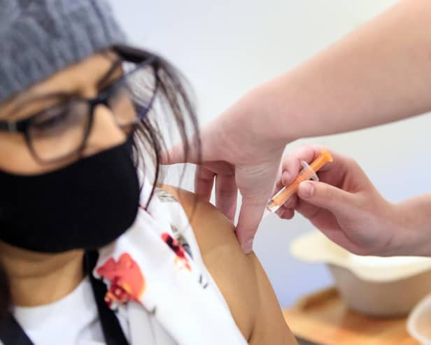 A woman receives an injection of the the Oxford/AstraZeneca coronavirus vaccine at Elland Road vaccine centre in Leeds picture: Danny Lawson/PA