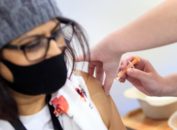 A woman receives an injection of the the Oxford/AstraZeneca coronavirus vaccine at Elland Road vaccine centre in Leeds picture: Danny Lawson/PA