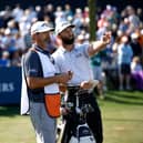 Jon Rahm talks with caddie Adam Hayes during the opening round of The Players Championship before withdrawing from the second round at TPC Sawgrass in Florida due to illness. Picture: Jared C. Tilton/Getty Images.
