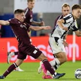 Hearts' Cammy Devlin challenges PAOK's Giannis Konstantelias. (Photo by Mark Scates / SNS Group)