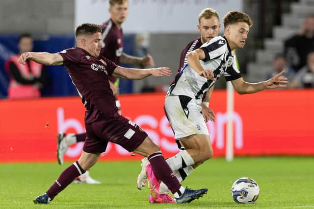 Hearts' Cammy Devlin challenges PAOK's Giannis Konstantelias. (Photo by Mark Scates / SNS Group)