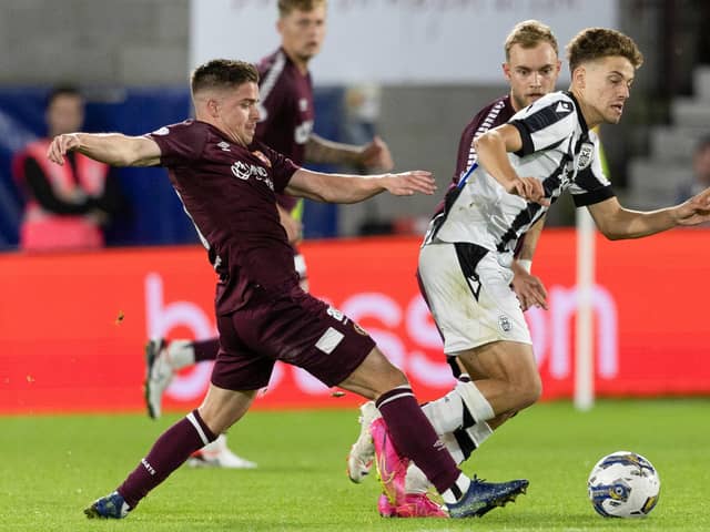 Hearts' Cammy Devlin challenges PAOK's Giannis Konstantelias. (Photo by Mark Scates / SNS Group)