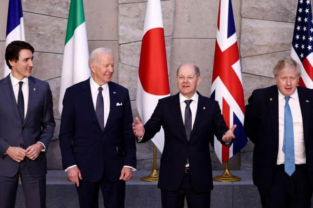 (L/R): Canada's Prime Minister Justin Trudeau, U.S. President Joe Biden, Germany's Chancellor Olaf Scholz and Britain's Prime Minister Boris Johnson pose for a G7 leaders' photo during a NATO summit at the alliance's headquarters in Brussels in March.