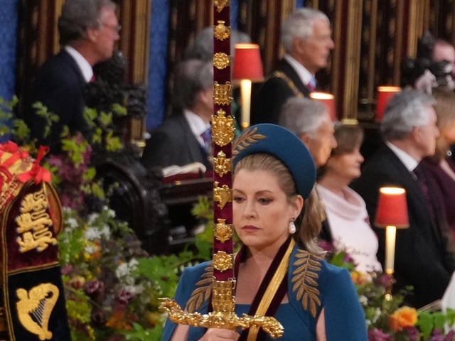Lord President of the Council, Penny Mordaunt, carrying the Sword of State,  in the procession through Westminster Abbey ahead of the coronation ceremony of King Charles III and Queen Camilla in London.