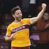 Motherwell's Ricki Lamie celebrates scoring against Hearts.