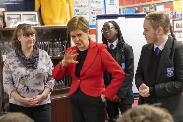 First Minister Nicola Sturgeon talking to pupils in a Modern Studies class during her visit to Whitehill Secondary School, Glasgow, to roll out the Scottish Child Payment. Picture date: Monday November 14, 2022.