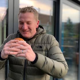 Chris Wilson ‘super sizes’ on a burger
