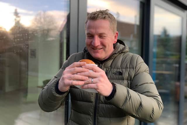 Chris Wilson ‘super sizes’ on a burger