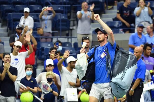 Andy Murray waves as he leaves the court after being defeated by Greece's Stefanos Tsitsipas during their US Open men's singles match