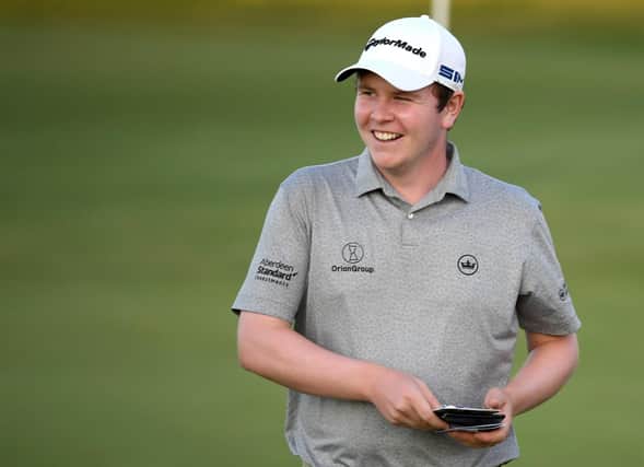 Bob Macintyre reacts on the 18th green after carding a six-under-par 65 in the first round to lead the Aphrodite Hills Cyprus Showdown. Picture: Ross Kinnaird/Getty Images