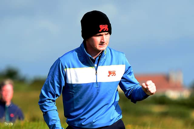 Sandy Scott of GB & Ireland celebrates holing a putt during the 2019 Walker Cup at Royal Liverpool Golf Club. Picture: Richard Martin-Roberts/R&A/R&A via Getty Images.