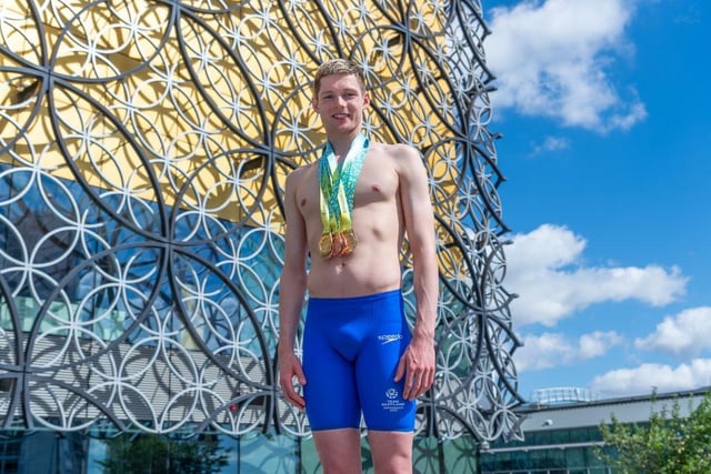 Duncan Scott of Team Scotland shows off his medals. He won two golds and three bronze medals in the pool to become Scotland's all-time most decorated Games competitor.