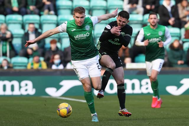 Hibs' Chris Cadden holds off Greg Taylor during the 0-0 draw with Celtic. (Photo by Alan Harvey / SNS Group)