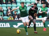 Hibs' Chris Cadden holds off Greg Taylor during the 0-0 draw with Celtic. (Photo by Alan Harvey / SNS Group)