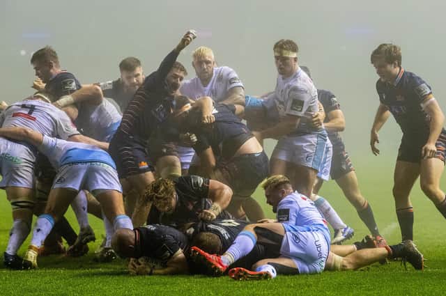 Edinburgh players celebrate David Cherry's try against Cardiff Blues at a foggy BT Murrayfield. Picture: Ross Parker / SNS