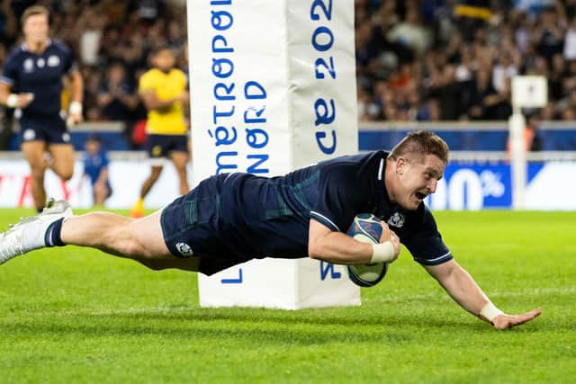 LILLE, FRANCE - SEPTEMBER 30: Scotland's Johnny Matthews scores a try during a Rugby World Cup match between Scotland and Romania at the Stade Pierre Mauroy, on September 30, 2023, in Lille, France. (Photo by Craig Williamson / SNS Group)