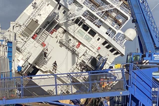 The vessel tilted at a 45-degree angle at Leith dock. Picture: @tomafc83 on Twitter