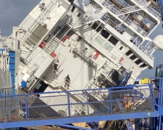 The vessel tilted at a 45-degree angle at Leith dock. Picture: @tomafc83 on Twitter