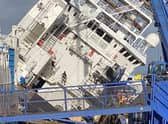 The vessel tilted at a 45-degree angle at Leith dock. Picture: @tomafc83 on Twitter