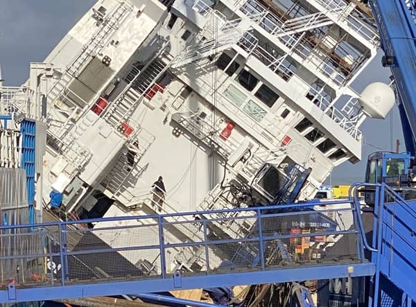 The vessel tilted at a 45-degree angle at Leith dock. Picture: @tomafc83 on Twitter