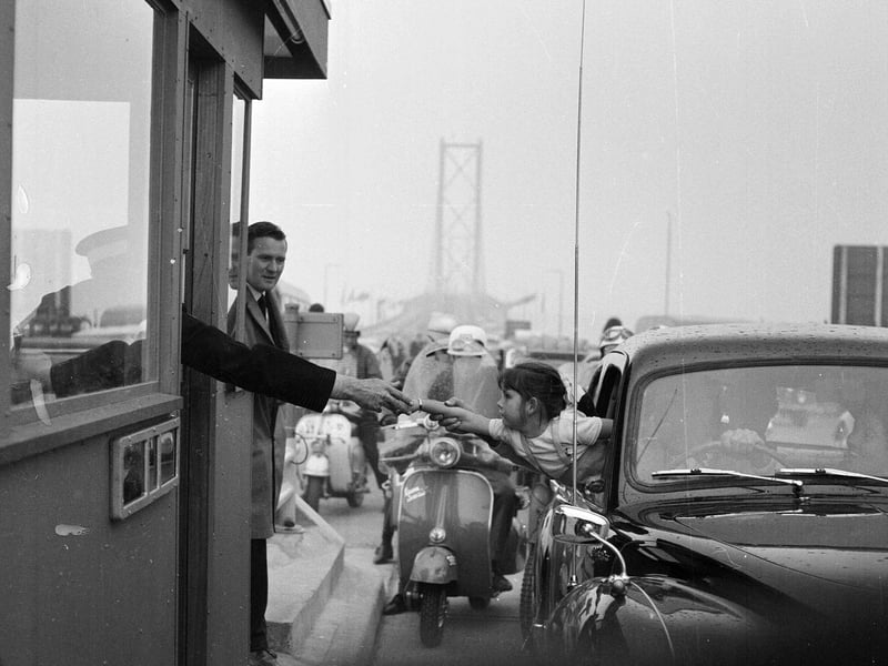 Forth Road Bridge is officially opened in September 1964 - Donna Morrison of Broughty Ferry pays her 2/6 toll.