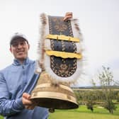 Euan Walker shows off the cow bell trophy after landing his weekend win in the Swiss Challenge at Golf Saint Apollinaire in Folgensbourg, France. Picture: Jan Hetfleisch/Getty Images.